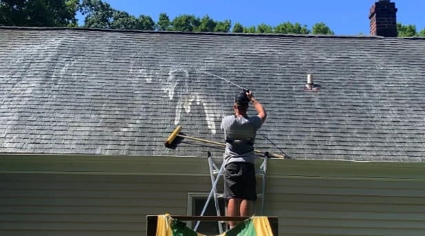 Before and after results of roof washing by Hudson Power Washing in Hudson