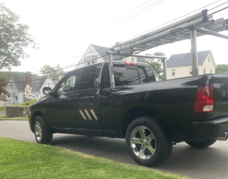 Fleet vehicle cleaning service being performed by Hudson Power Washing in Hudson