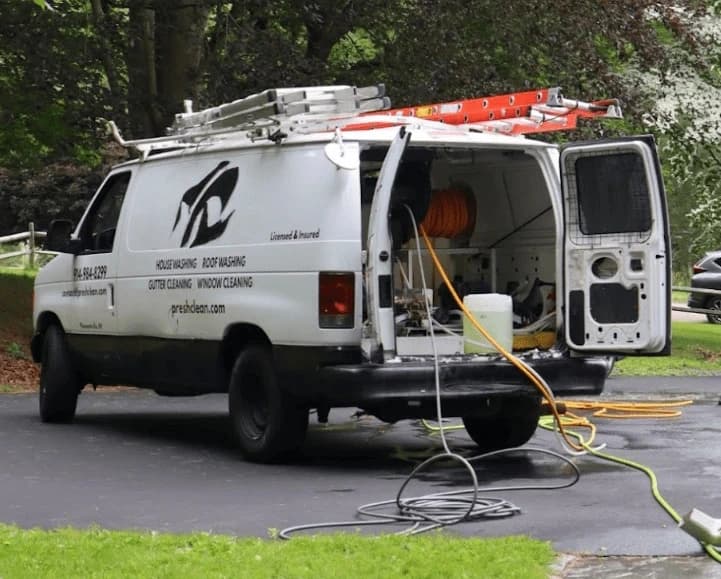 Hudson Power Washing professionals cleaning commercial fleet in Hudson